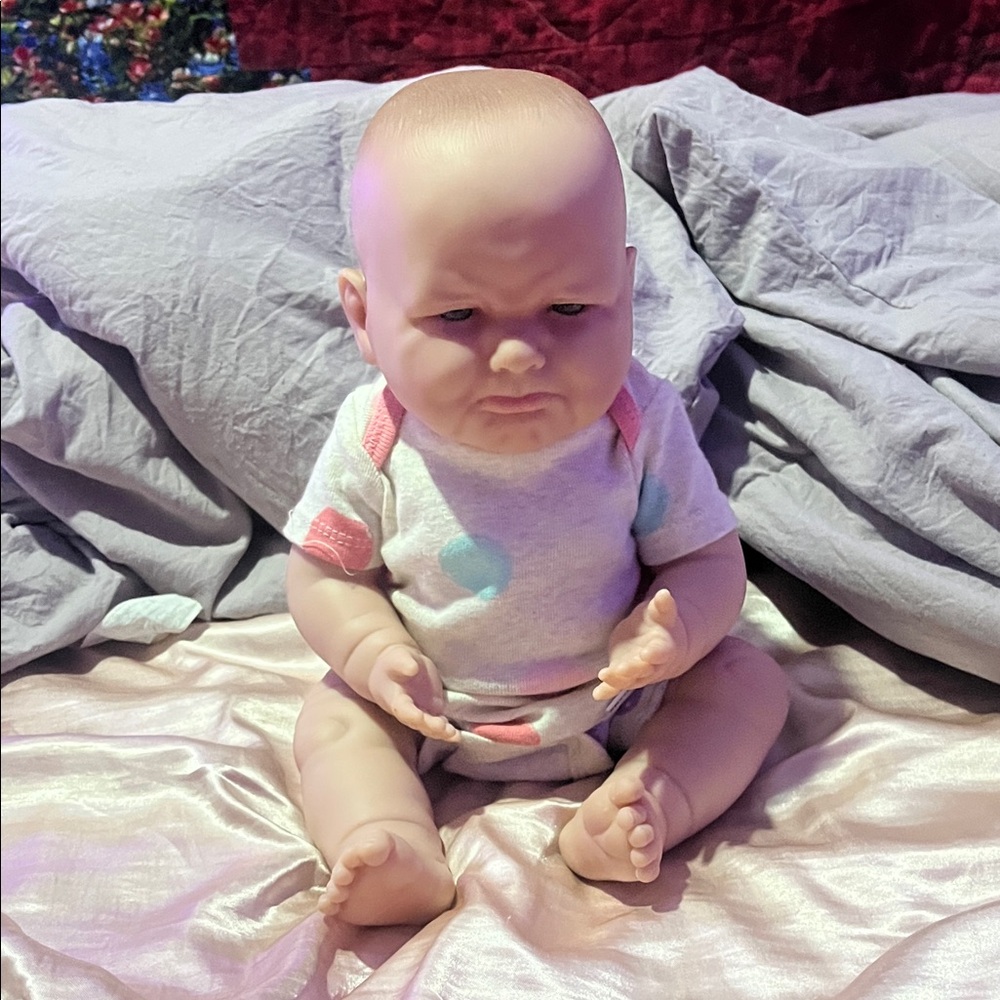 Realistic Baby Doll with Colorful Outfit